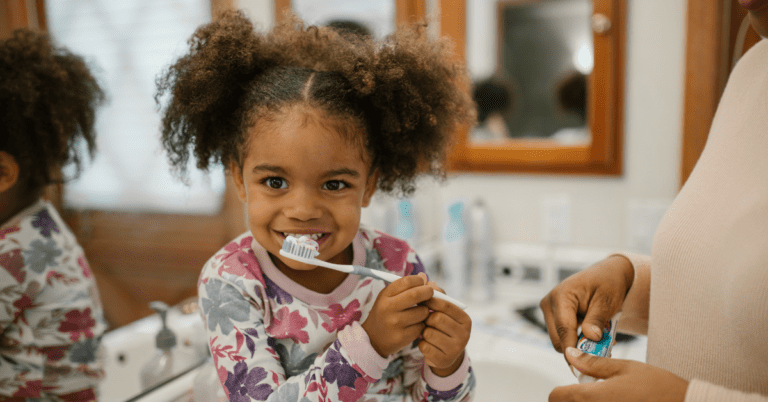 A child brushing their teeth.