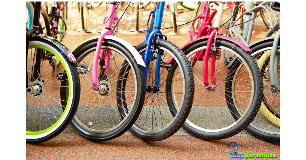 A row of colorful bicycles are lined up next to each other near a sidewalk. This implies that the piece is about adaptive bikes for autism.